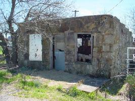 The old stone building is decorated with a number of fossils.