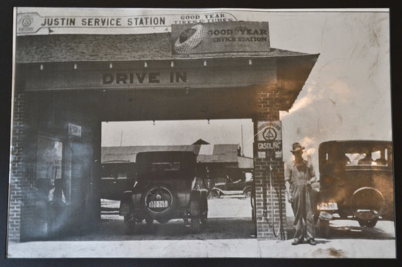 An old photograph of the Justin Service Station hangs on the wall at the Major League Realty office, showing how little has changed.